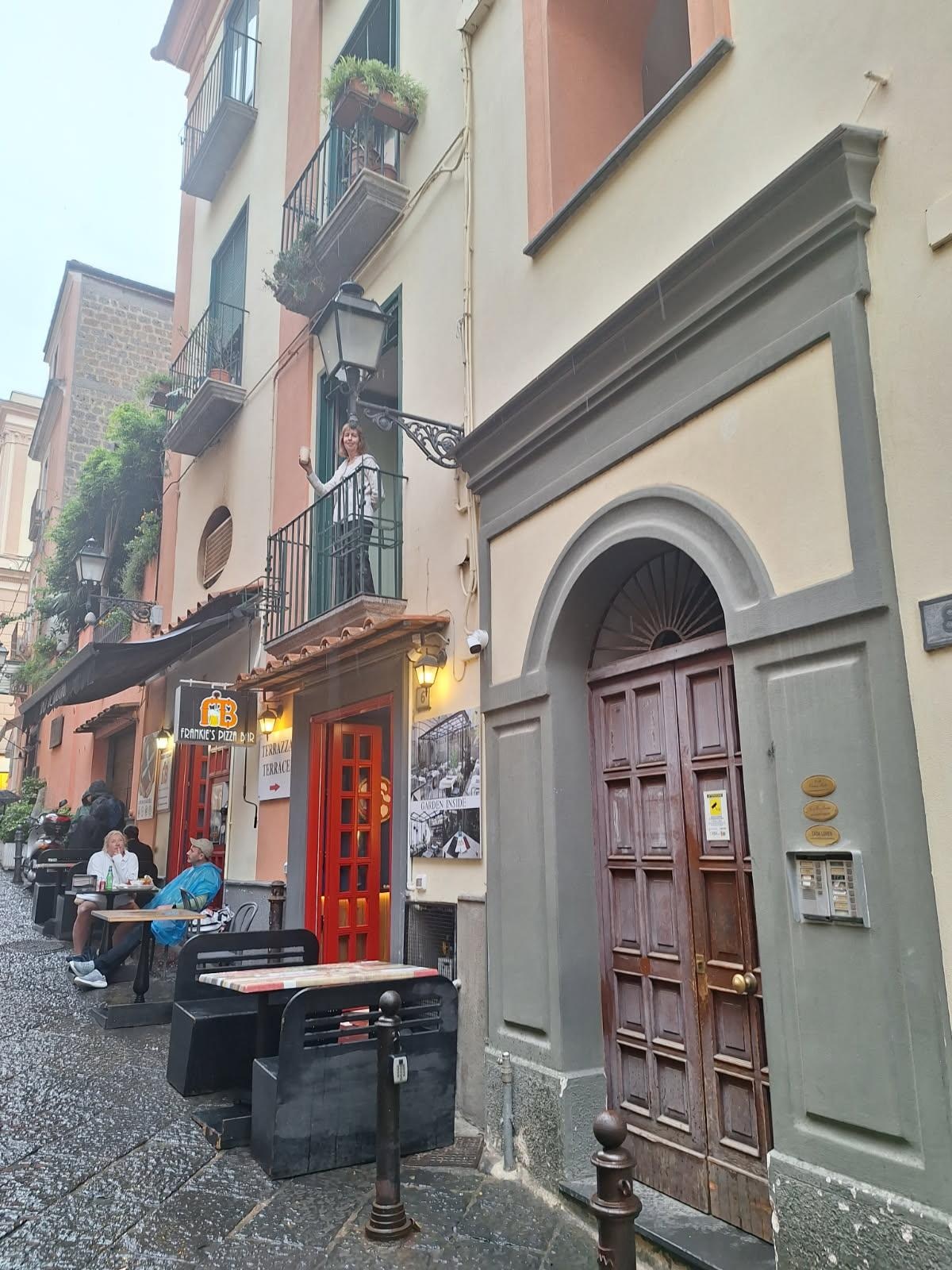 Entrance next to Frankie’s Pizza Bar