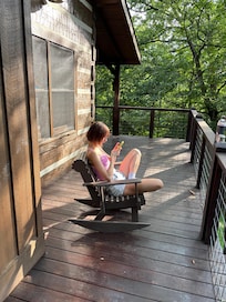 The recent high school grad reading on the deck