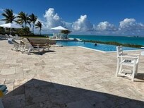 View of the pool and ocean , steps from the house.