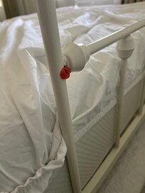 while remaking the bed with a fitted sheet, I found this. easy for housekeeping to miss, but if I found it, shouldn't they have? I removed it.