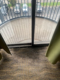 Molded carpet and pooling water on balcony
