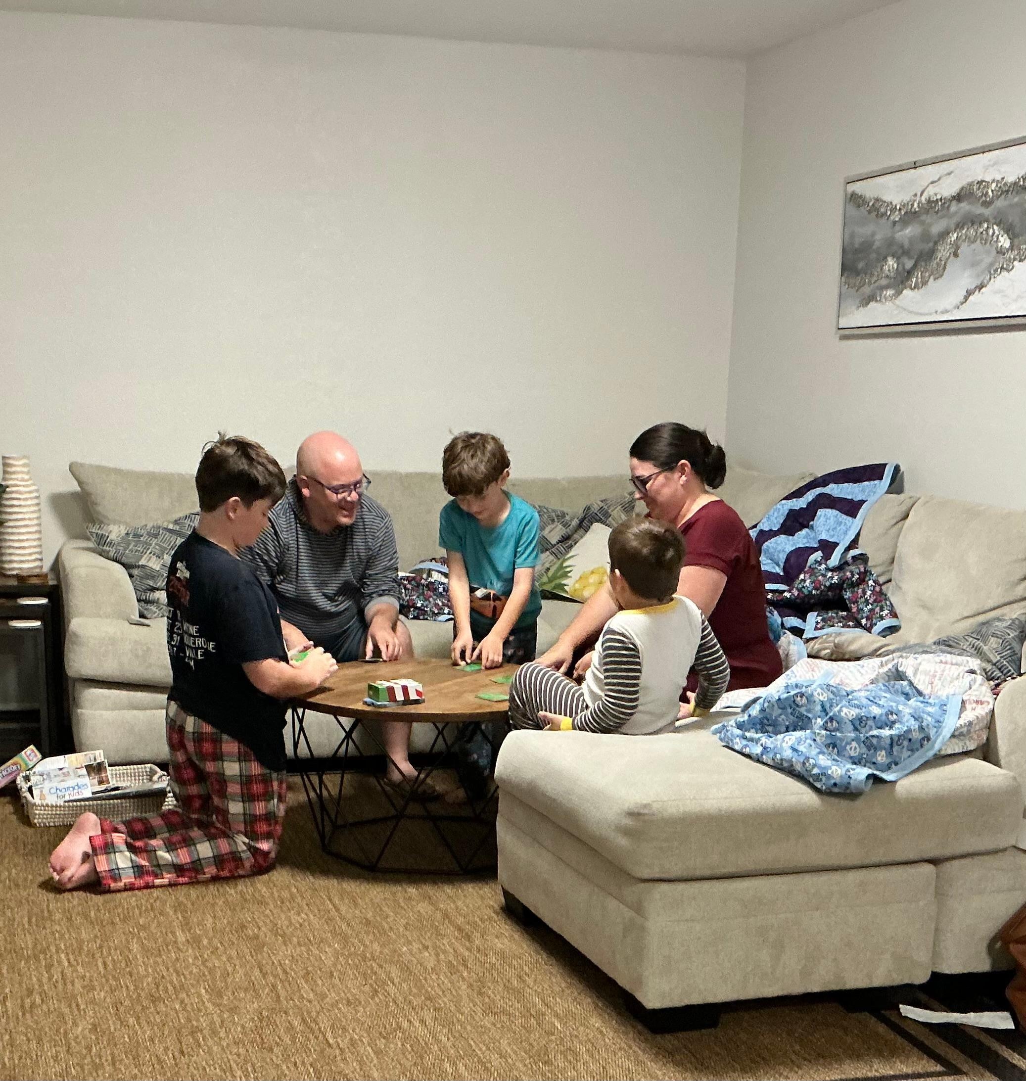 My family playing one of the many board/card games supplied with the house.