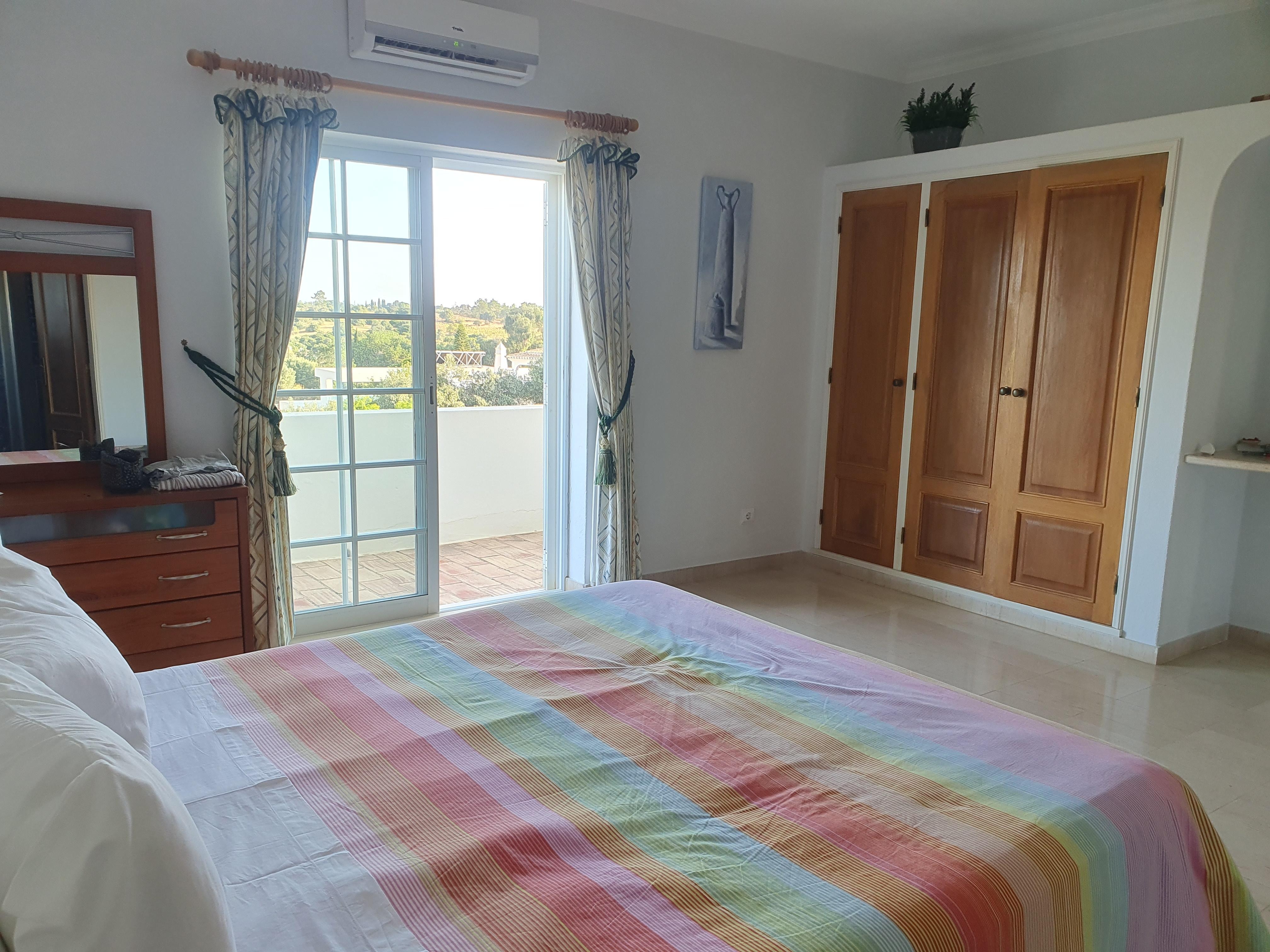 Main bedroom, with balcony over looking garden
