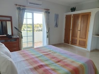 Main bedroom, with balcony over looking garden