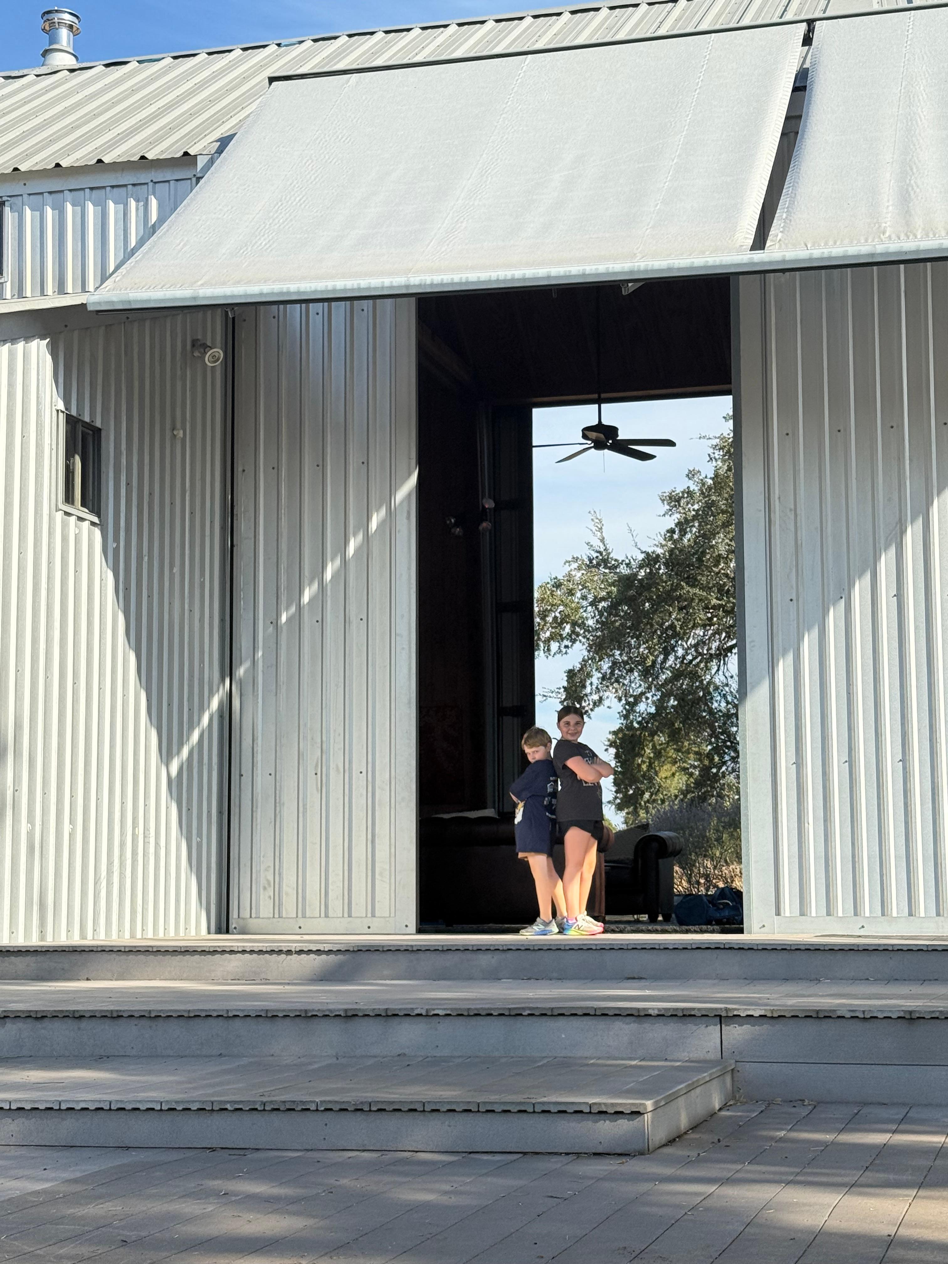 Barn doors open and back porch like a stage. 