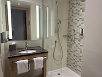 The glass surfaces and faucet handles gleamed, reflecting the meticulous attention to detail