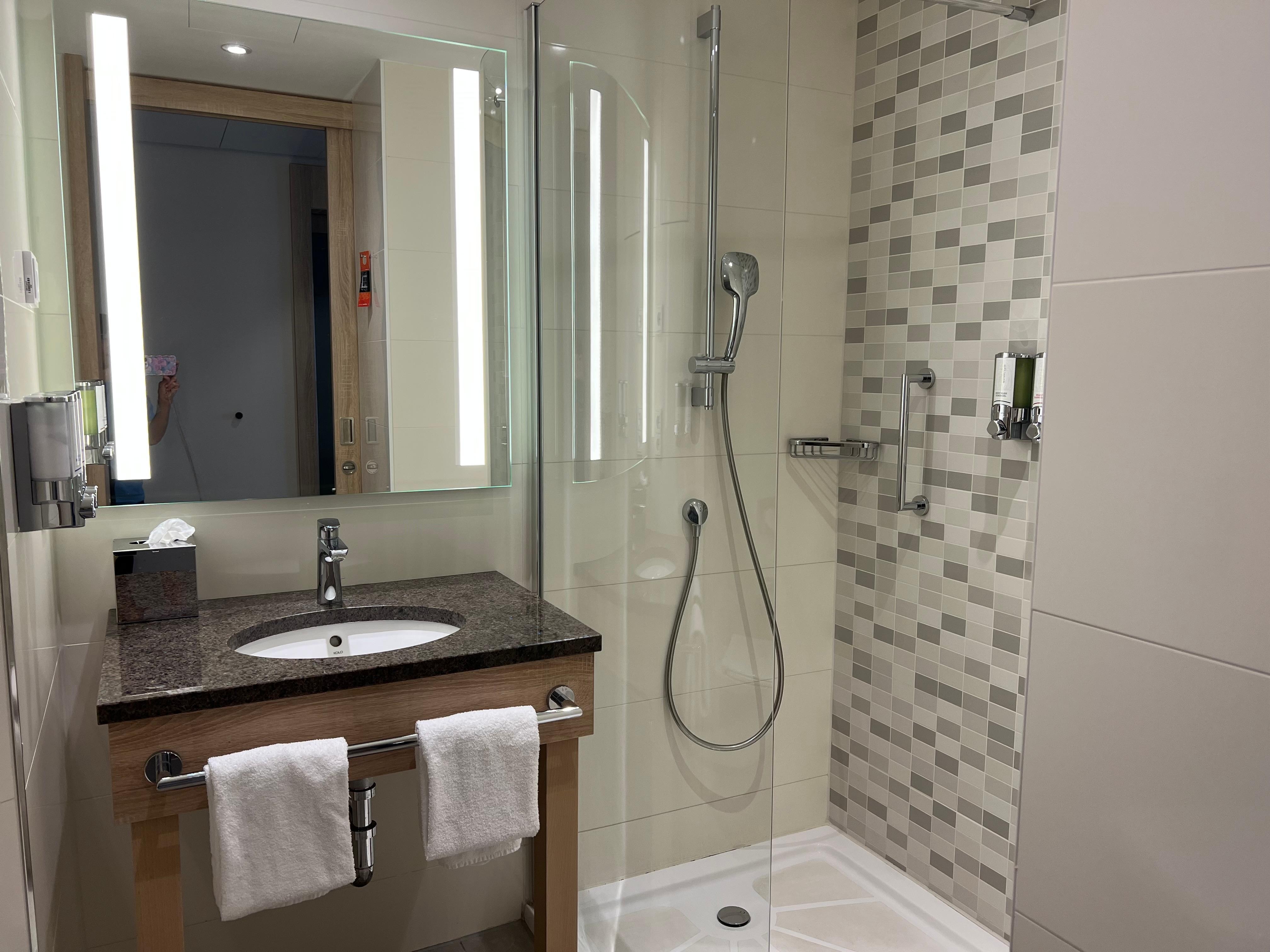 The glass surfaces and faucet handles gleamed, reflecting the meticulous attention to detail