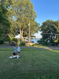 Cornhole and view of the lake from the front porch. A perfect summer night.