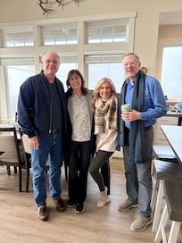 This was taken in the great room which includes the kitchen area. Tall ceilings and so full of sunlight. Water is right out the picture window! What a view! Gorgeous place !