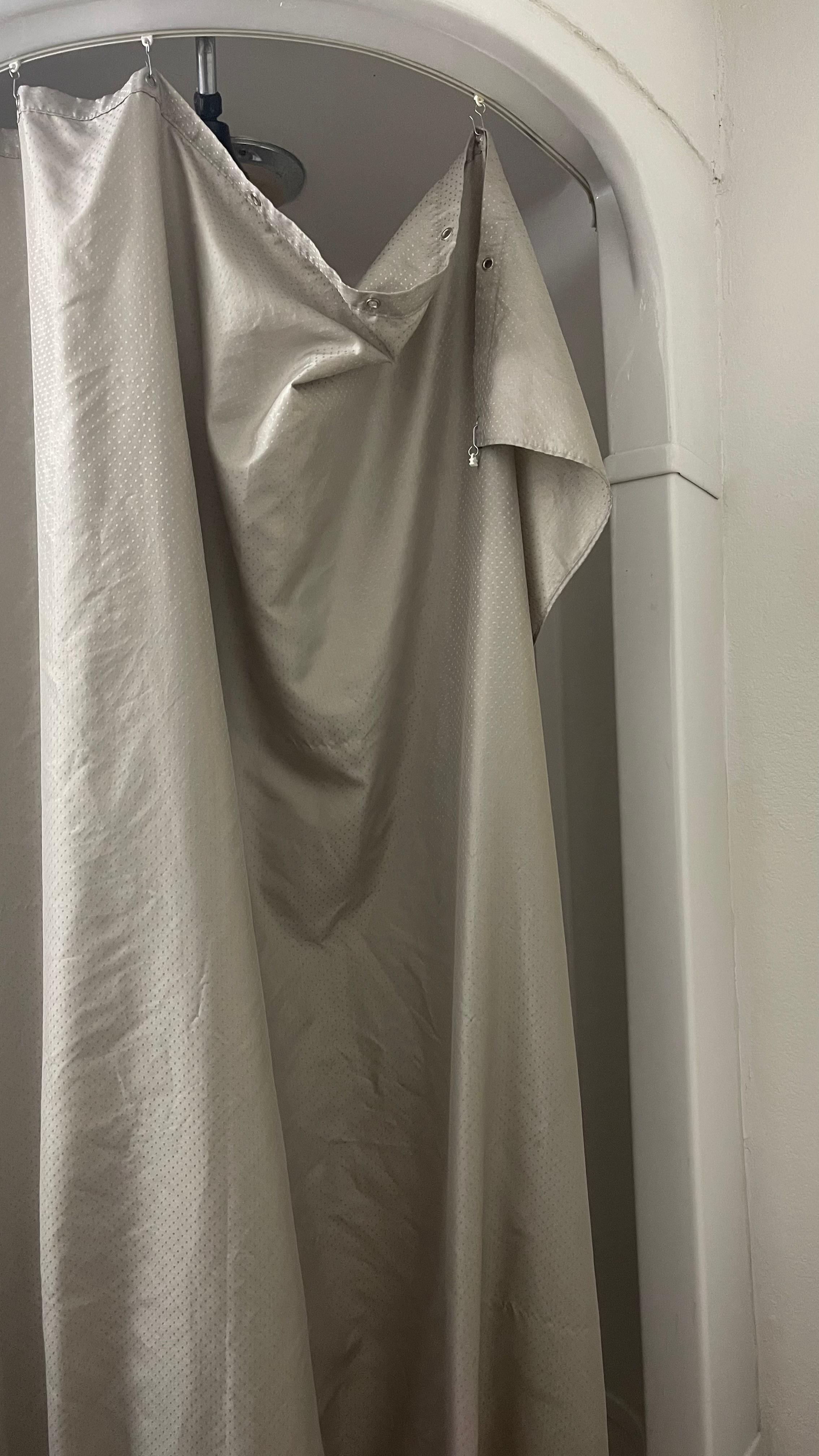 Shower curtain after we tried to fix it.