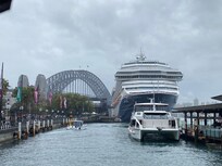 Cruise ship docked at Circular Quay with Harbour Bridge in background.