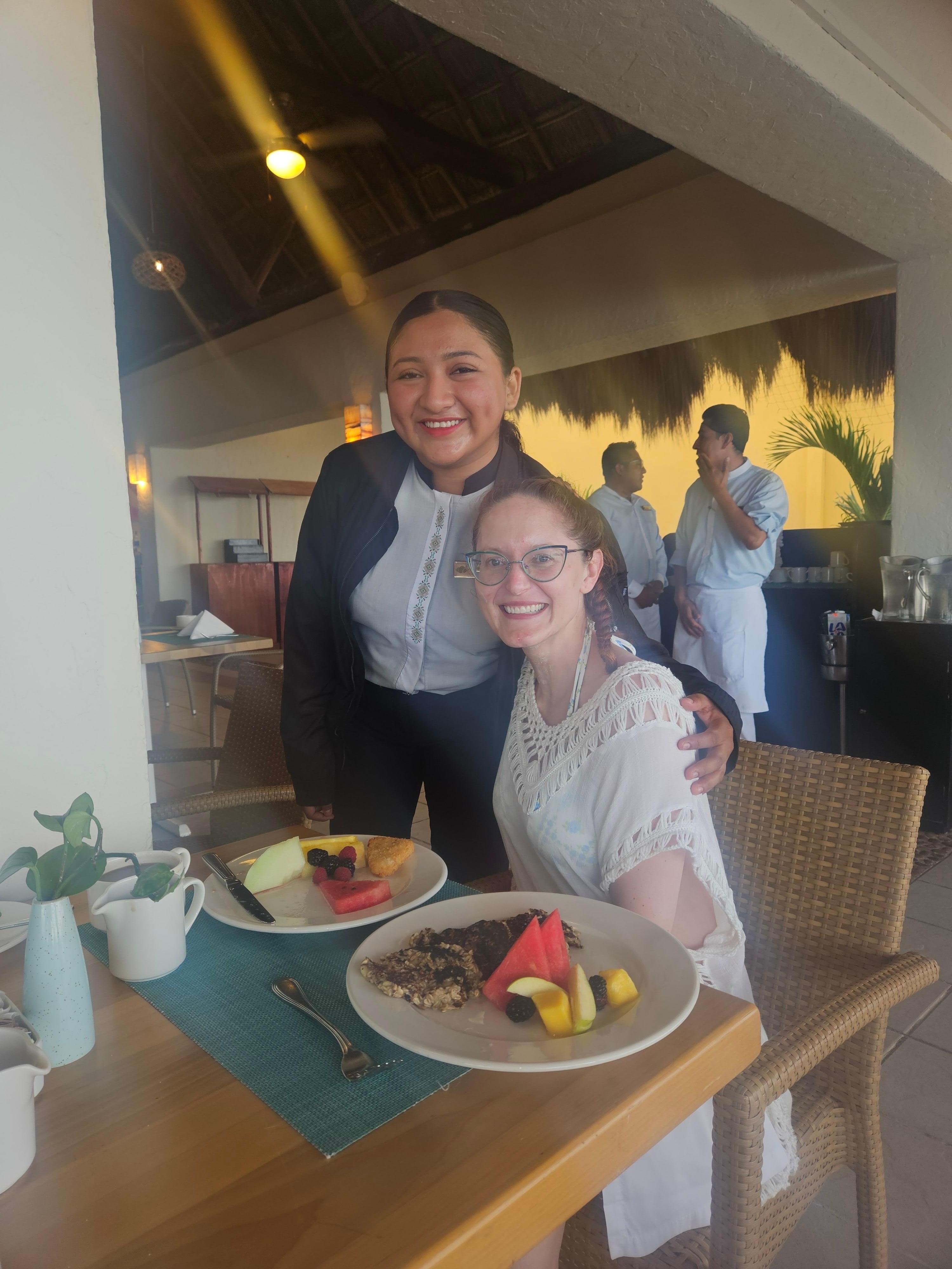 Eloisa and the food prepared by the chef at Market Cafe to keep my celiac wife safe and fed.