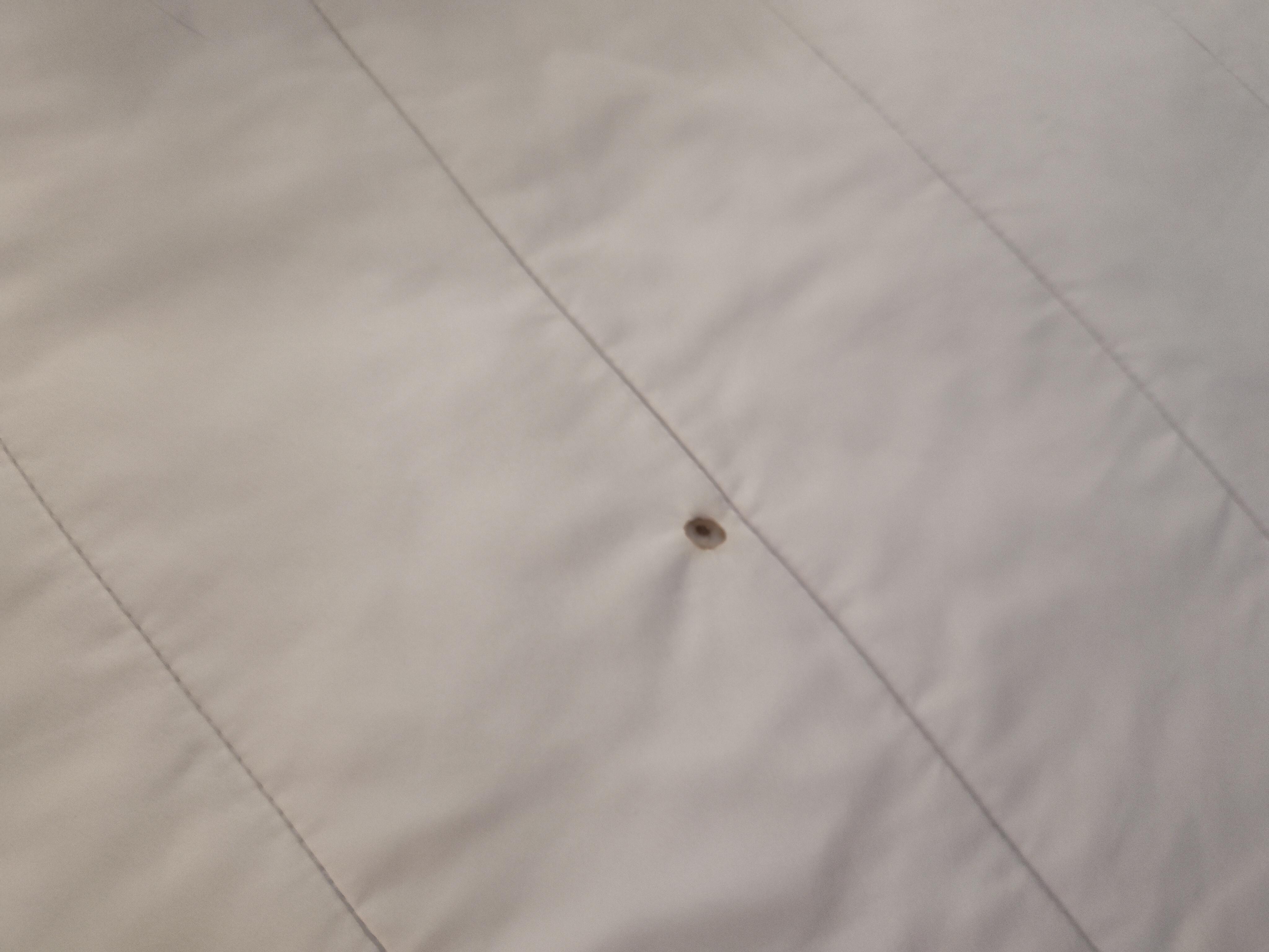 Cigarette burn in bedding