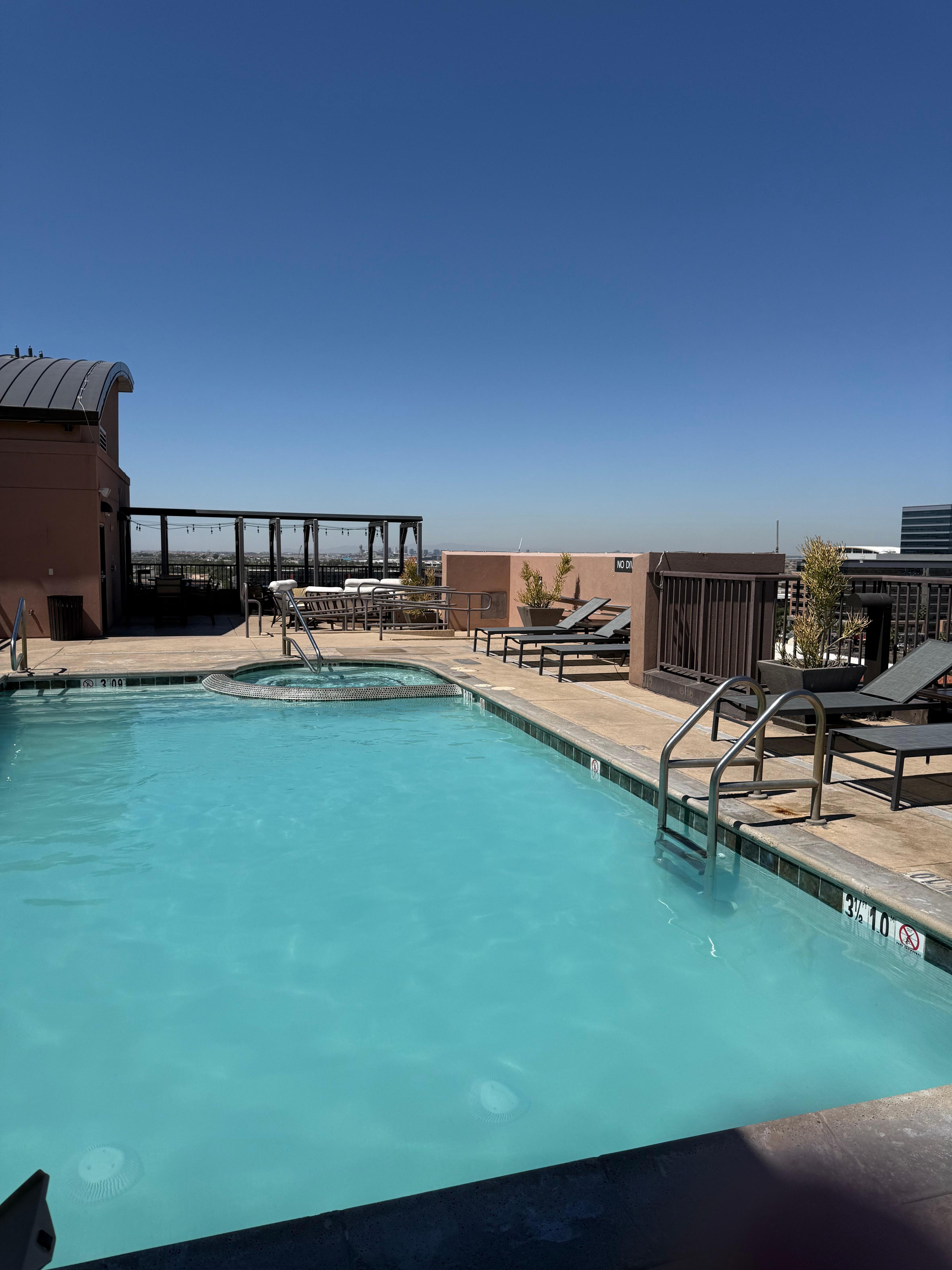 Rooftop Lounge area and pool. Mountain and city views