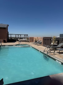 Rooftop Lounge area and pool. Mountain and city views