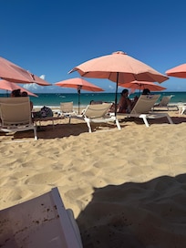 Tryst beach area with umbrellas and chairs. Super convenient!