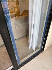 Sliding door to upstairs patio/fire pit had been shattered. Incredibly difficult to open and close all of the sliding doors actually.