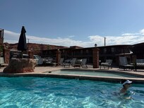 Pool area. Cute waterfall and hot tub area