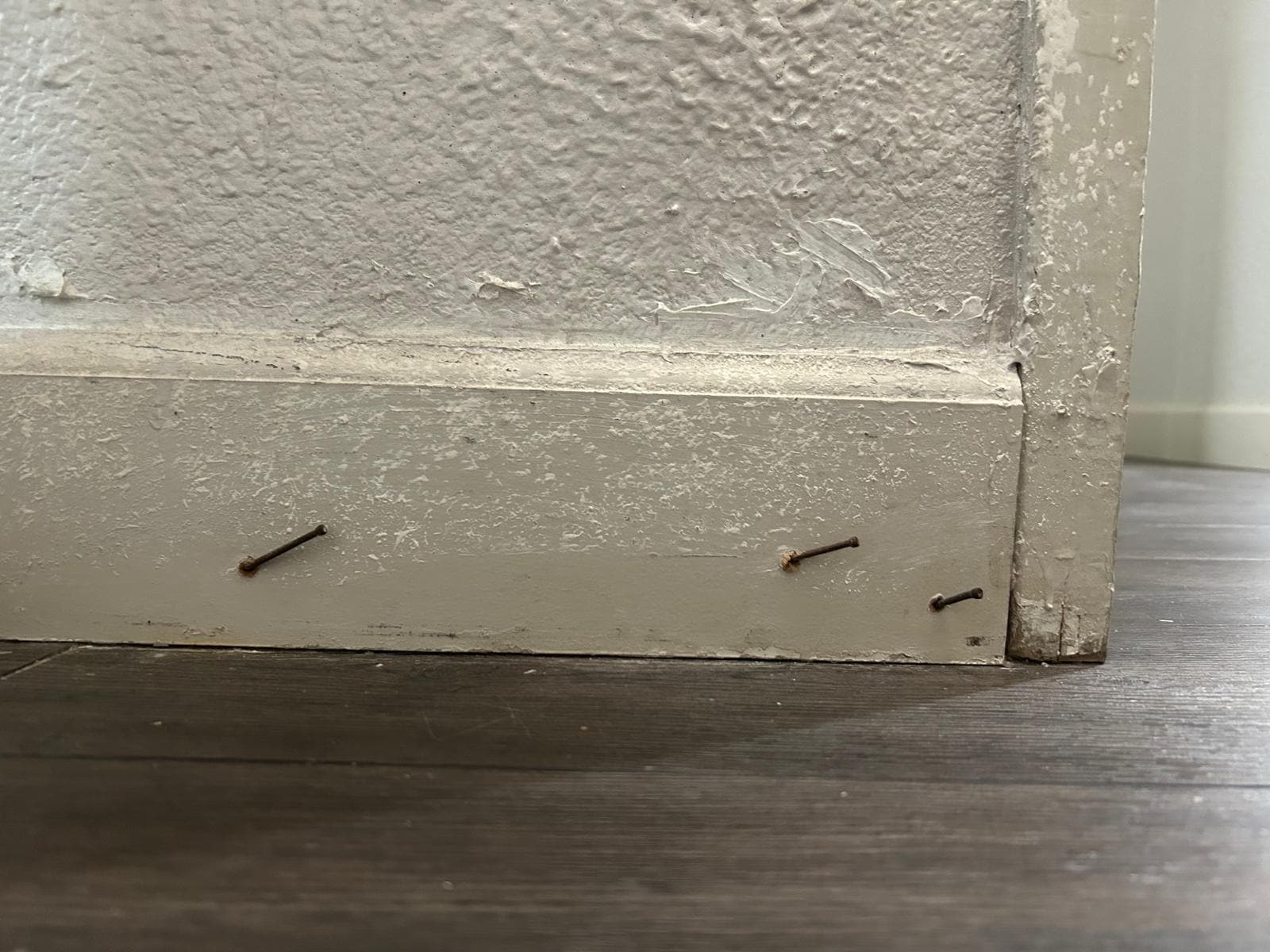 Nails protruding from door. 