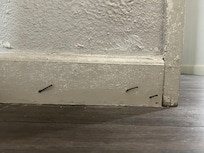 Nails protruding from door.