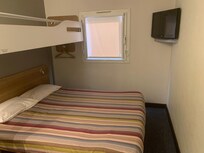 Very small room, carpets dirty, duvet burned, tv not working.