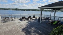 Deck below house overlooking the lake. Lots of seating. Enjoy even a hot day if you come up from a dip in the lake.