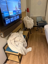 Room when we arrived, no bed made, dirty linens everywhere