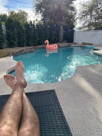 Cooling off by the pool after a round of golf.