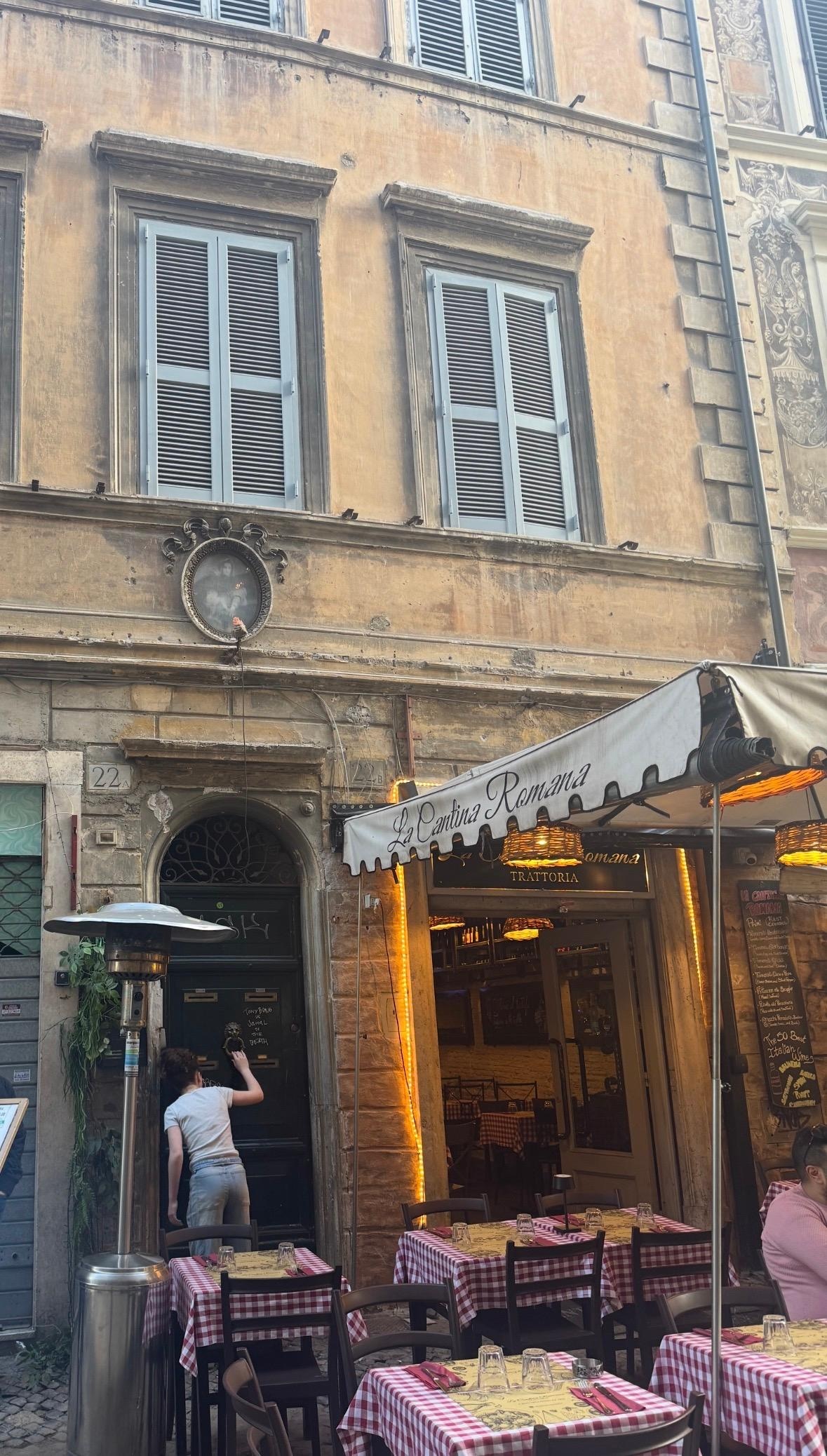 Entry door, windows above are property, on 2nd story. 