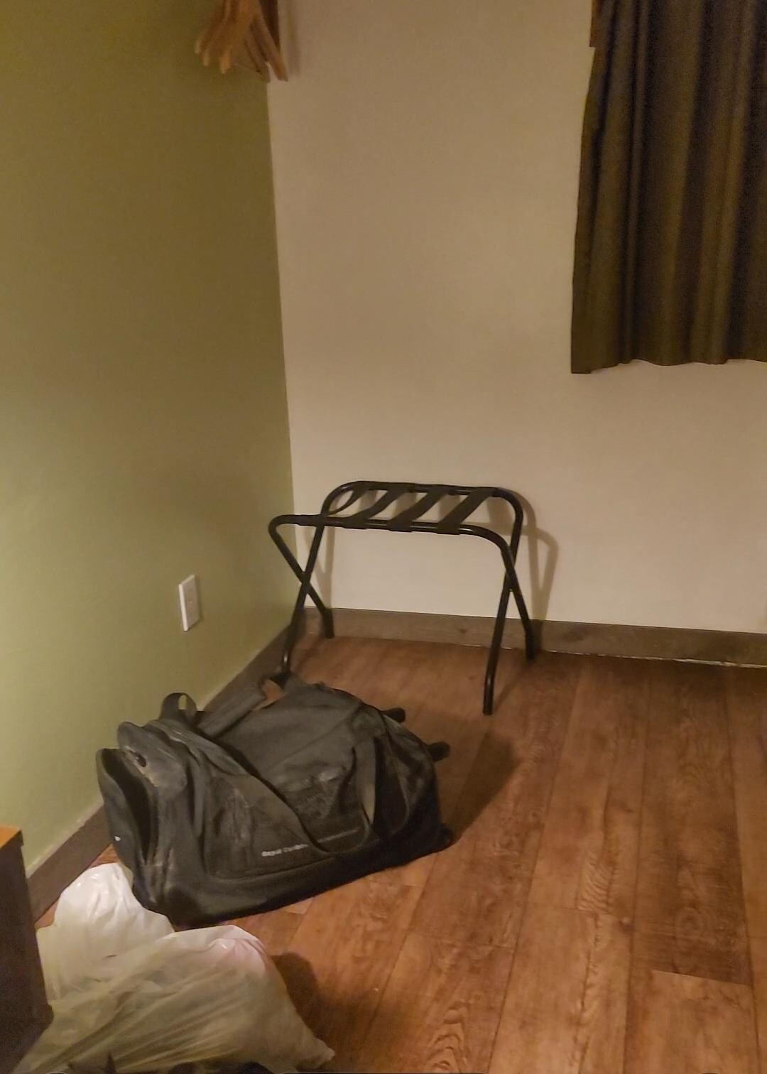 Luggage rack but no closet or nook.