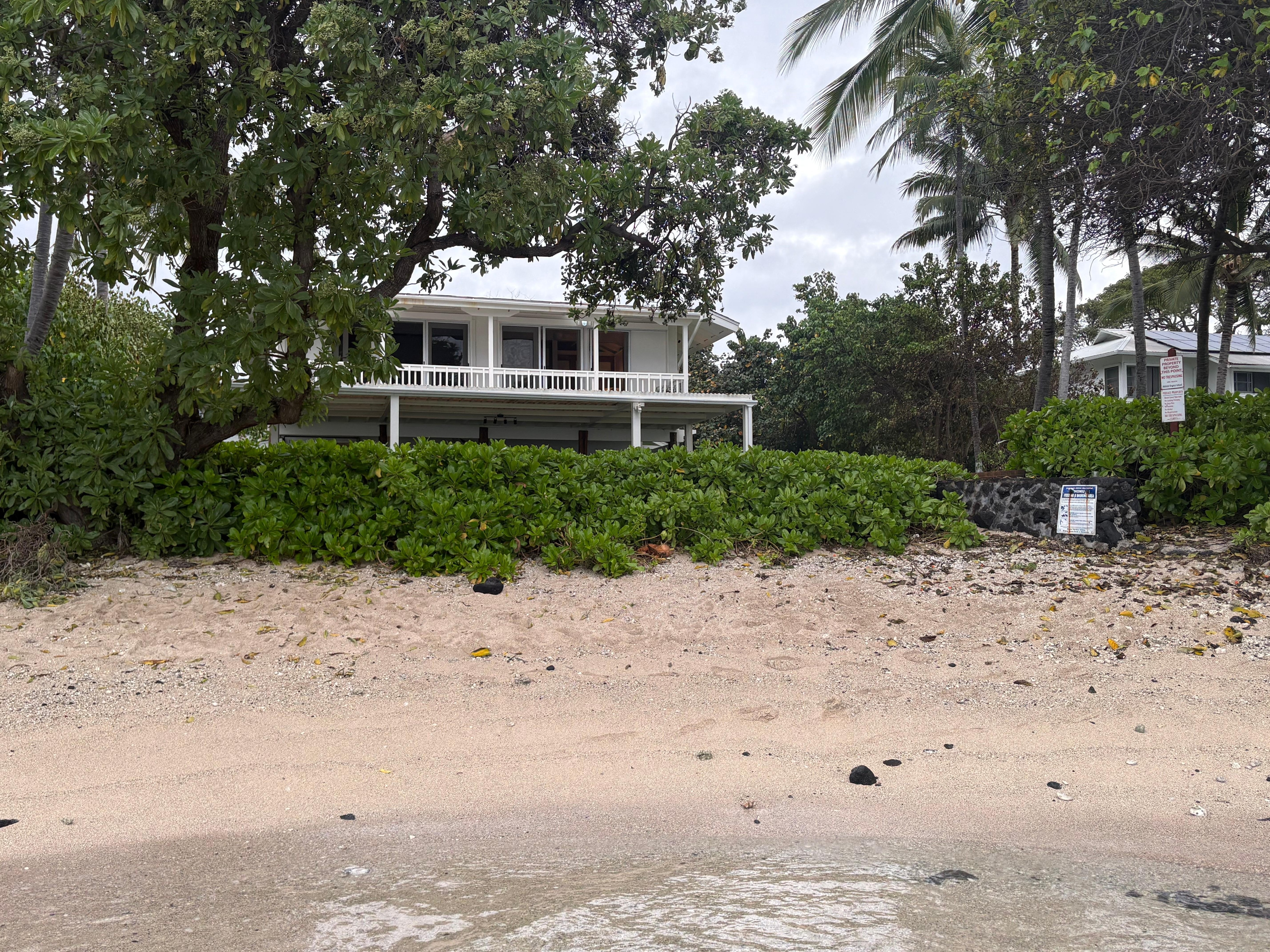 View of house from water.  Note that other people can also use this beach.  