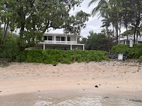 View of house from water. Note that other people can also use this beach.