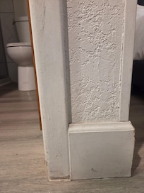 All the woodwork and walls in the room were grubby.