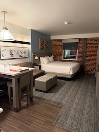 Studio Suite with 1 king bed, pull out couch, and Kitchen