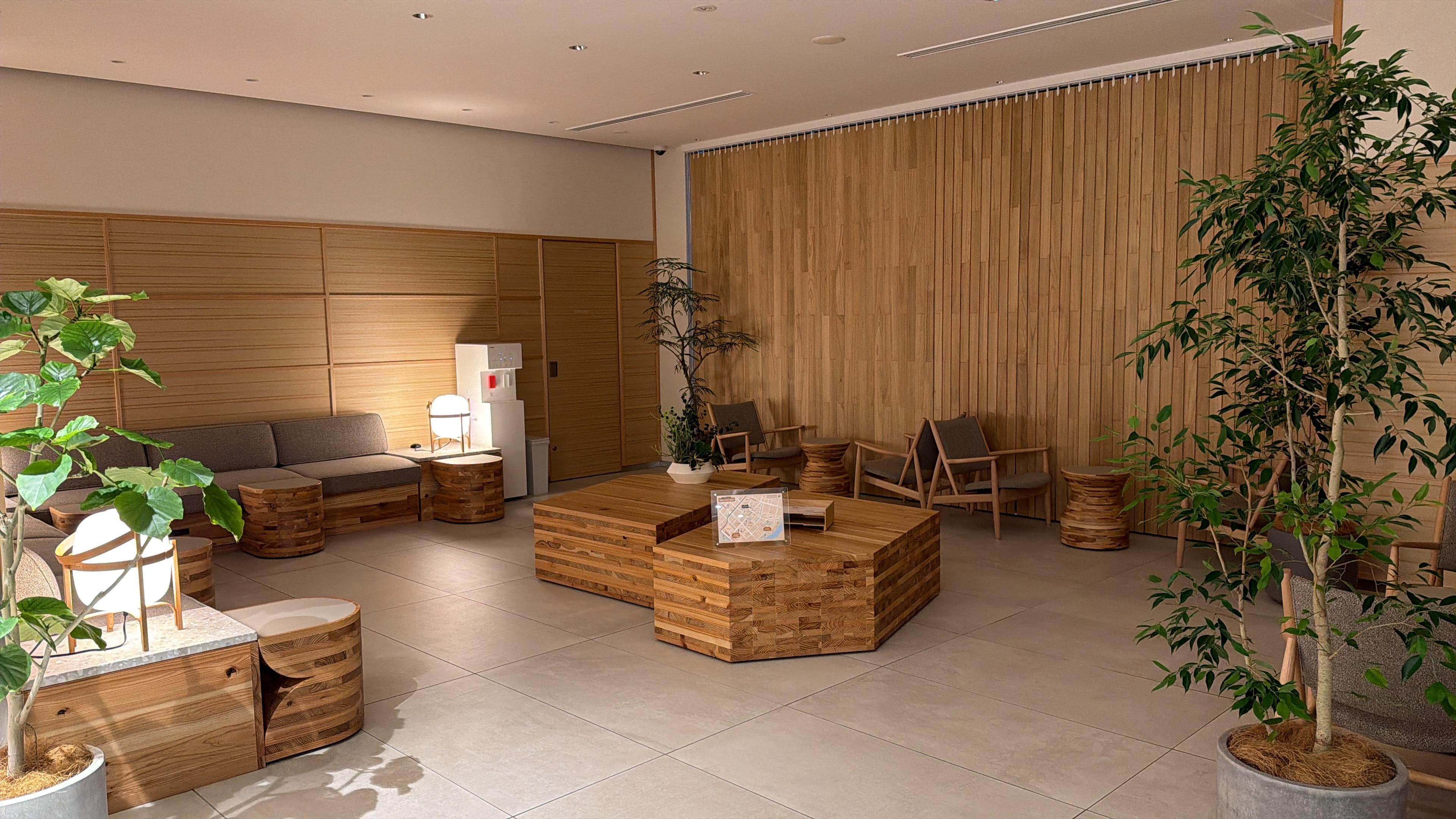 Lobby with self check in and front desk to assist