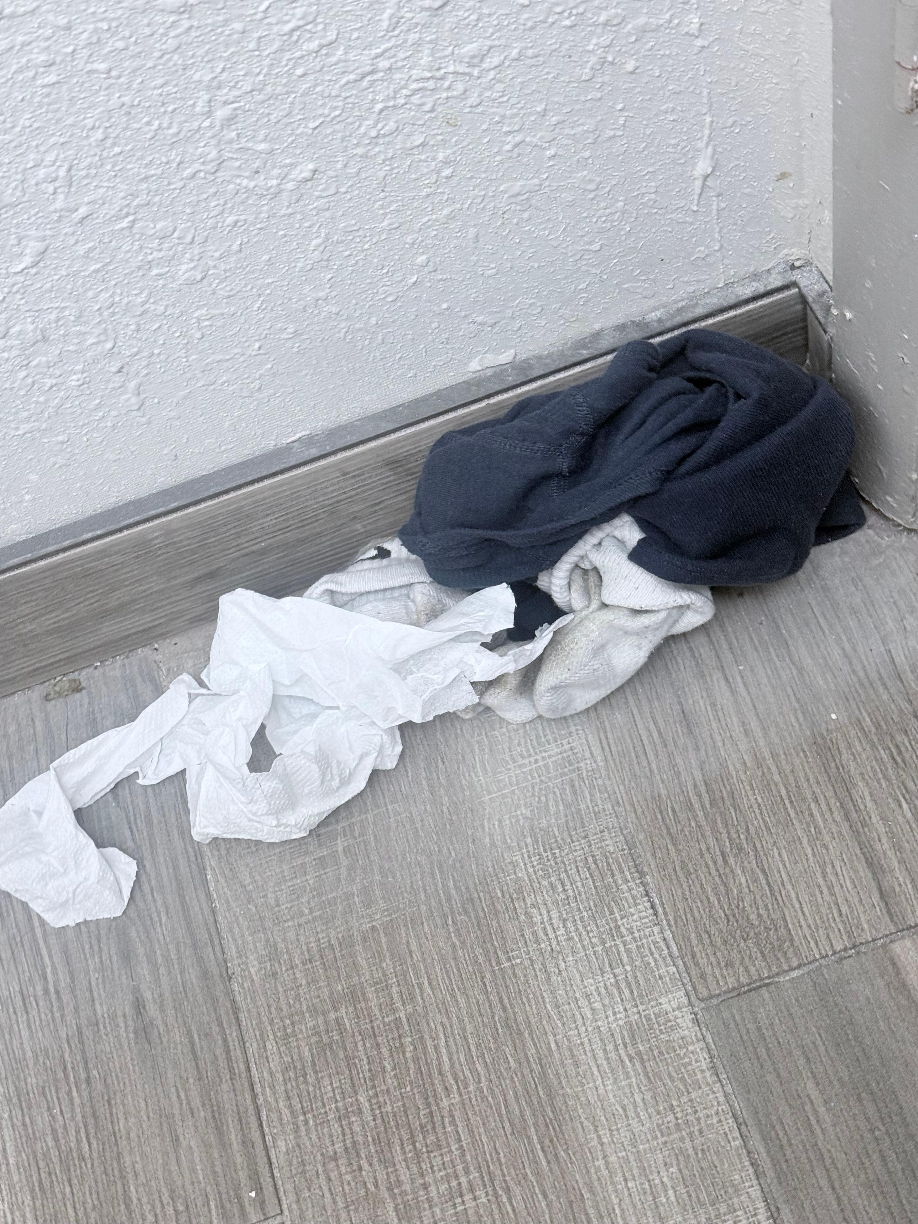 Dirty clothes left by last person. 