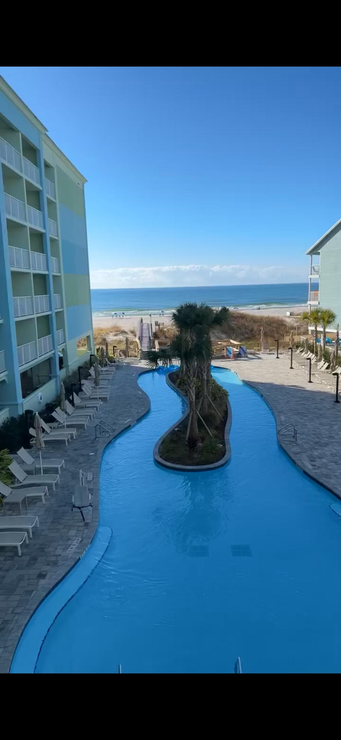 Picture taken from balcony. You can see building to left that was closer to beach
