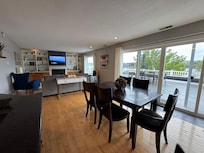 Amazing great room with lots of windows and roof top patio