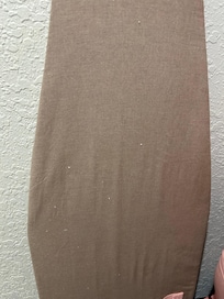 Ironing board with paint all over it