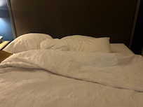 My bed AFTER housekeeping “serviced” my room.