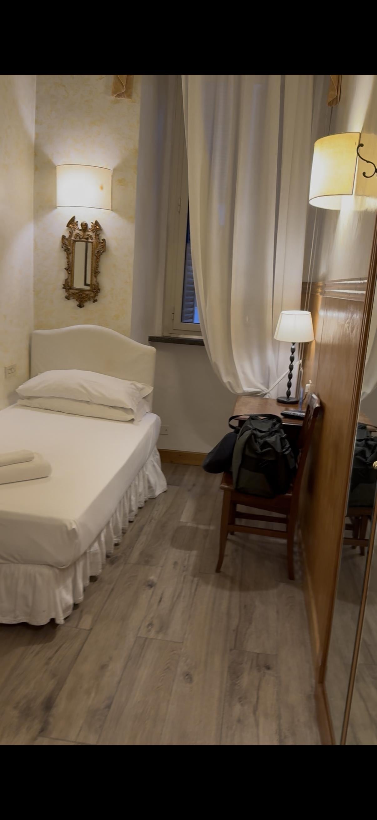 One of the twin beds, other is directly in front of this one. 