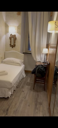 One of the twin beds, other is directly in front of this one.