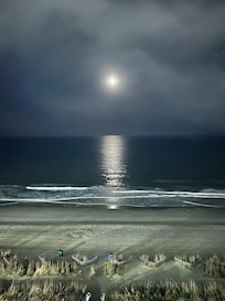 At Night hearing the waves and moon reflecting on the water. Great atmosphere and beach vacation.