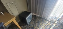 Just a random mini fridge sitting on the ground