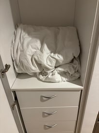 Some badly old wrinkled bedding for the twin beds that really are smaller than twin size