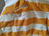 Torn pool towel