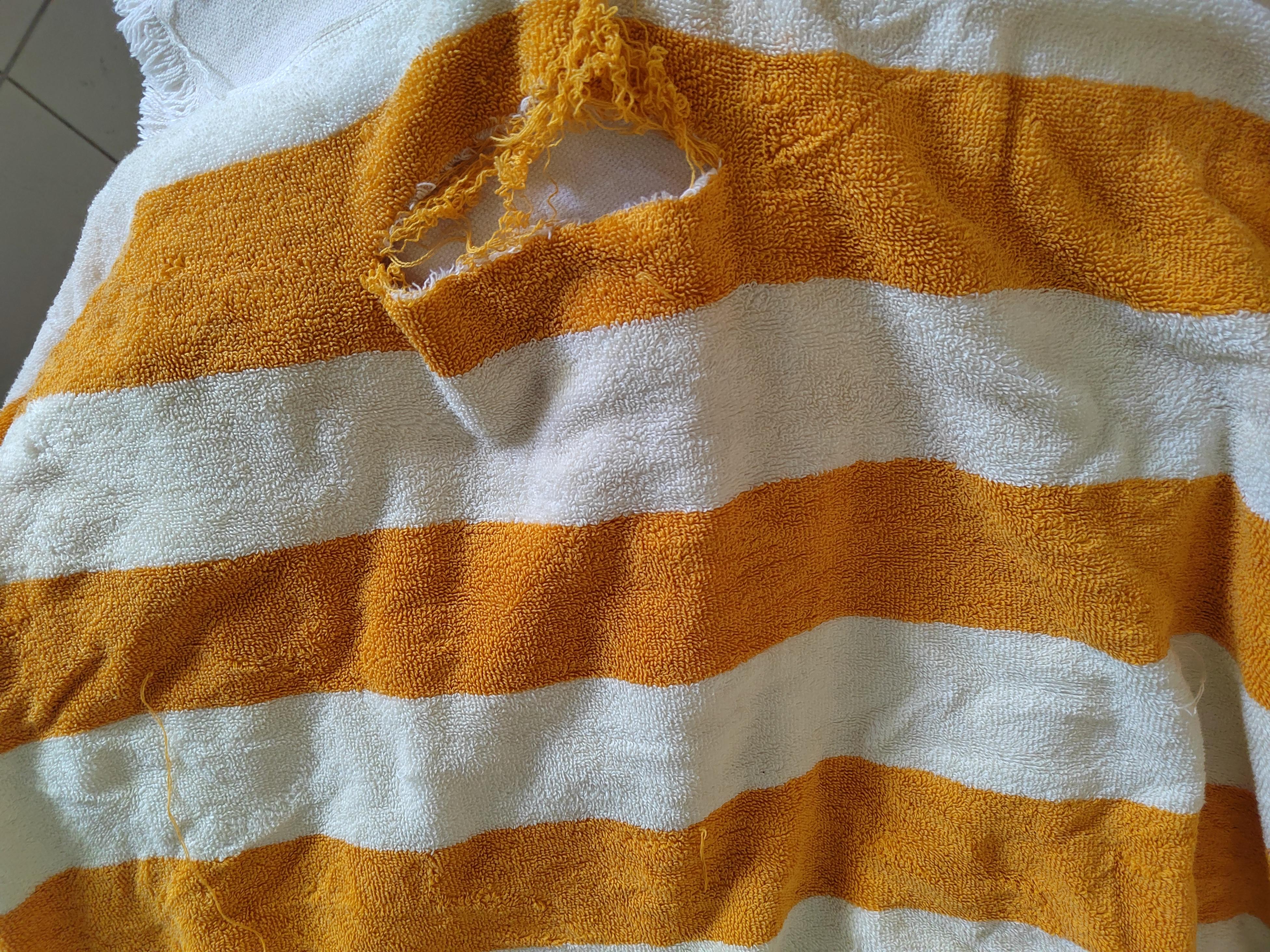 Torn pool towel