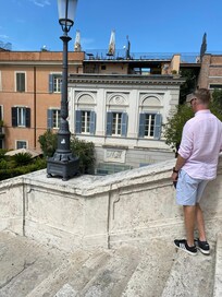 Three sets of blue shuttered windows were our room. See the wine bar above.
