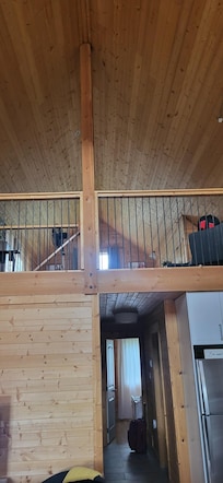 Inside looking from front door up to loft