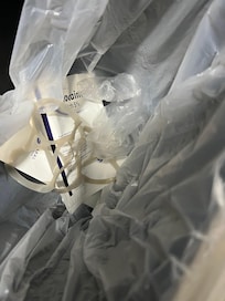 There’s a small bottle of whiskey, plastic gloves, lidocaine patches, and paraphernalia in the trashcan